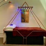 Large copper meditation pyramid used for energy alignment and healing at Pyramid Wellness
